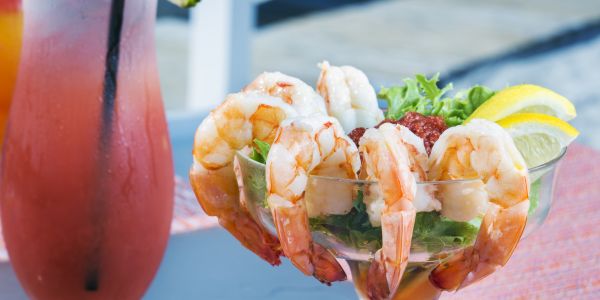 Shrimp cocktail and a frozen drink.
