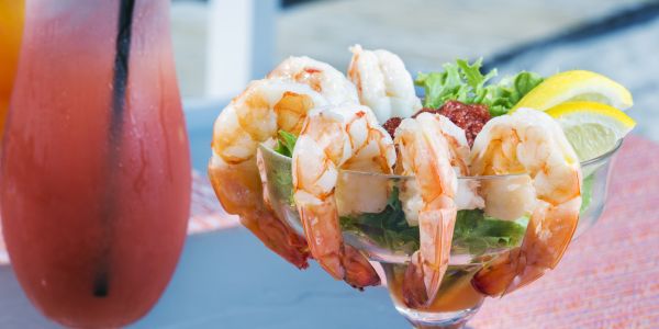 Shrimp cocktail and a frozen drink.